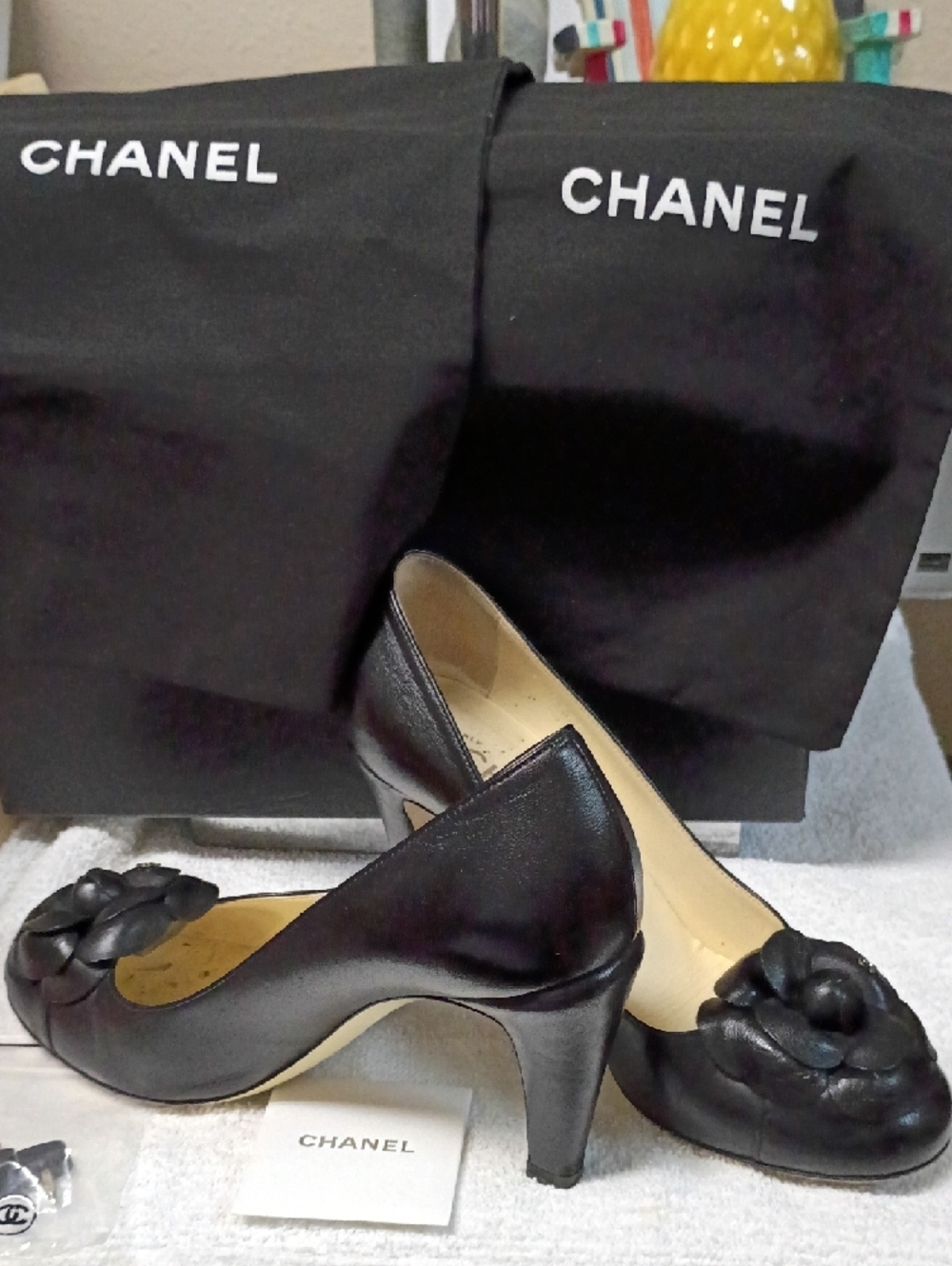 CHANEL Black Leather Camellia-Embellished Heels
